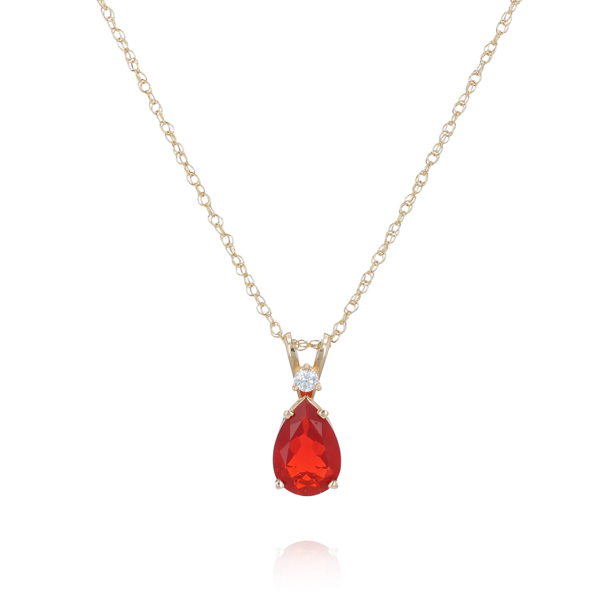 Yellow gold pear shape fire opal and diamond pendant necklace on a white background