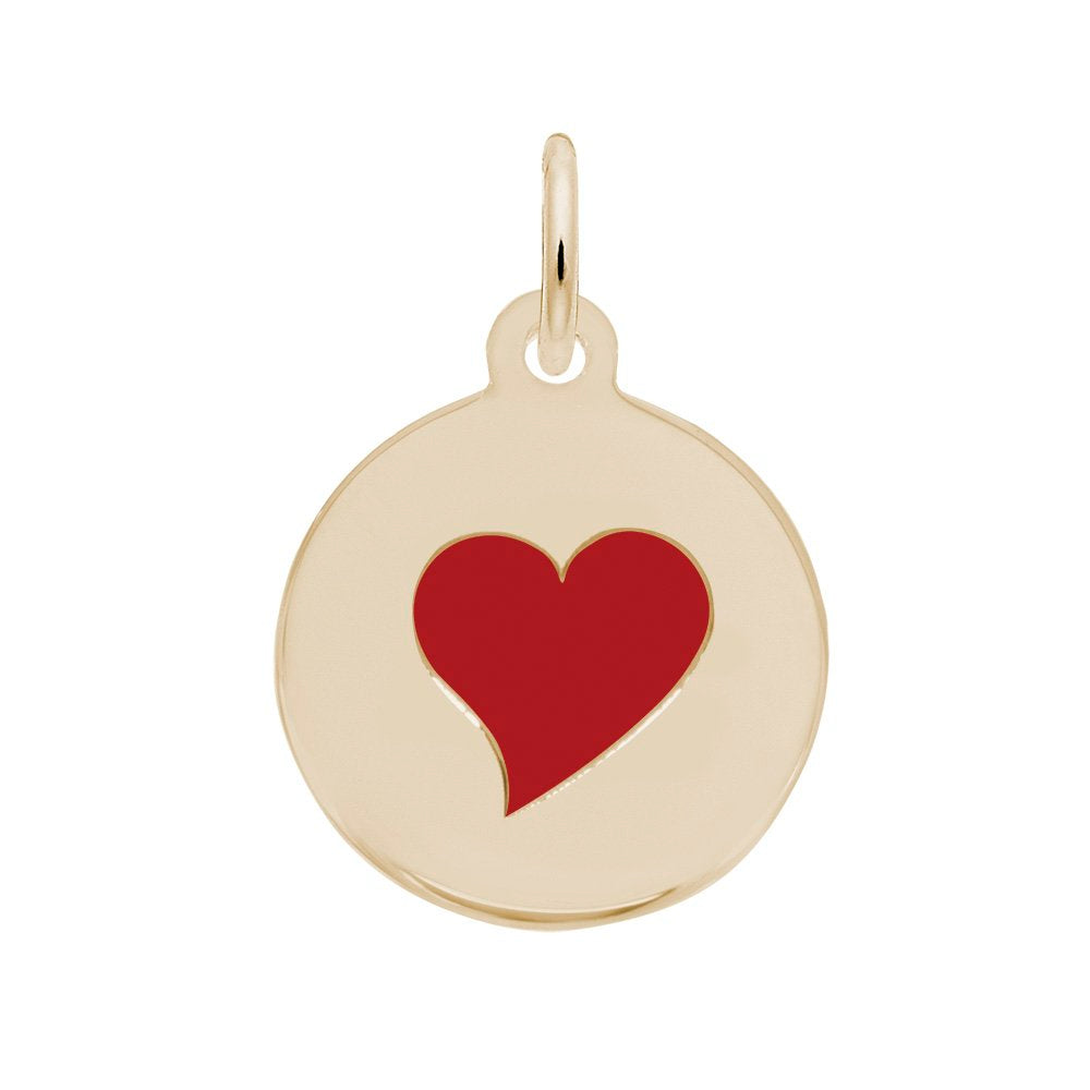Gold pendant with a red heart on a white background