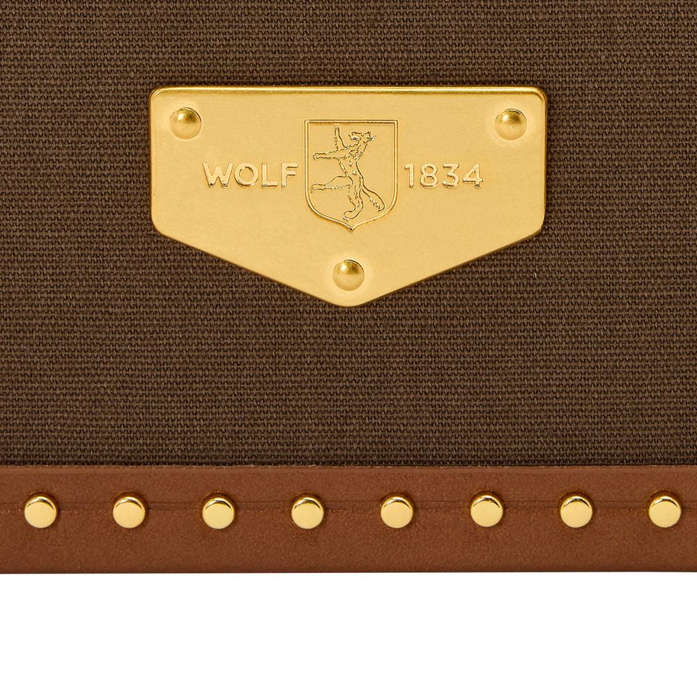 Gold label with 'WOLF 1834' on a brown textured surface