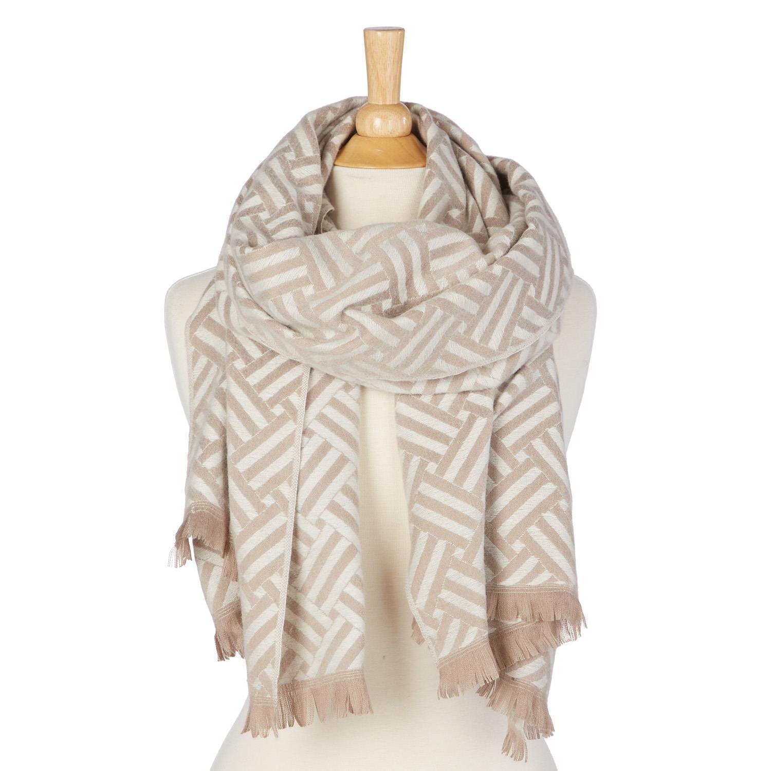 Beige and white patterned scarf on a mannequin against a white background