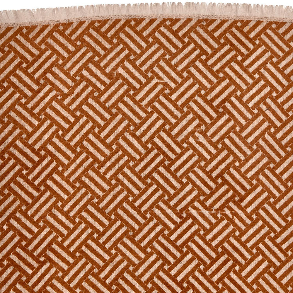 Close-up of a tan & beige patterned scarf in a geometric design 