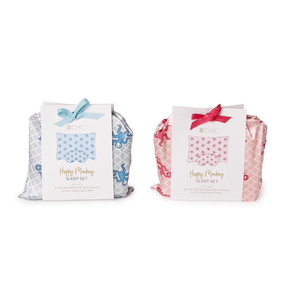 Two 'Happy Monkey' sleep set packages, one with blue pattern and the other with pink pattern, on a white background.