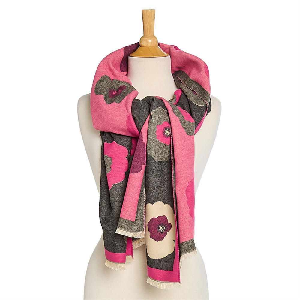 Floral patterned scarf in a pop pink & gray on a mannequin with a white background.