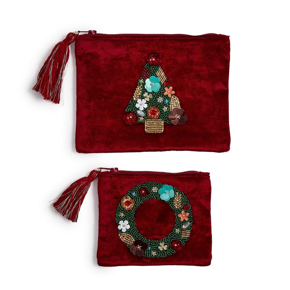 Two red velvet pouches with embroidered Christmas tree and wreath designs on a white background.
