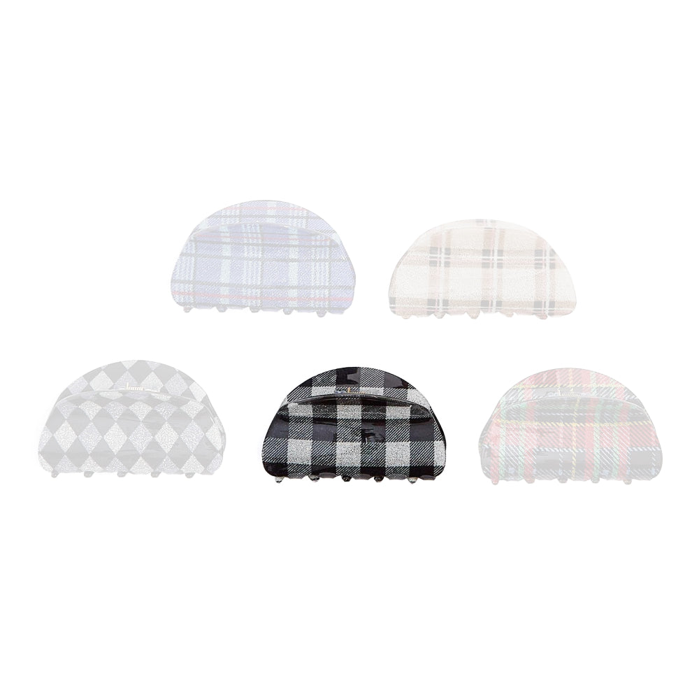 Checkered black plaid colored hair clips on a white background