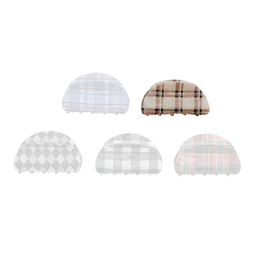 Tan plaid colored hair clip on a white background