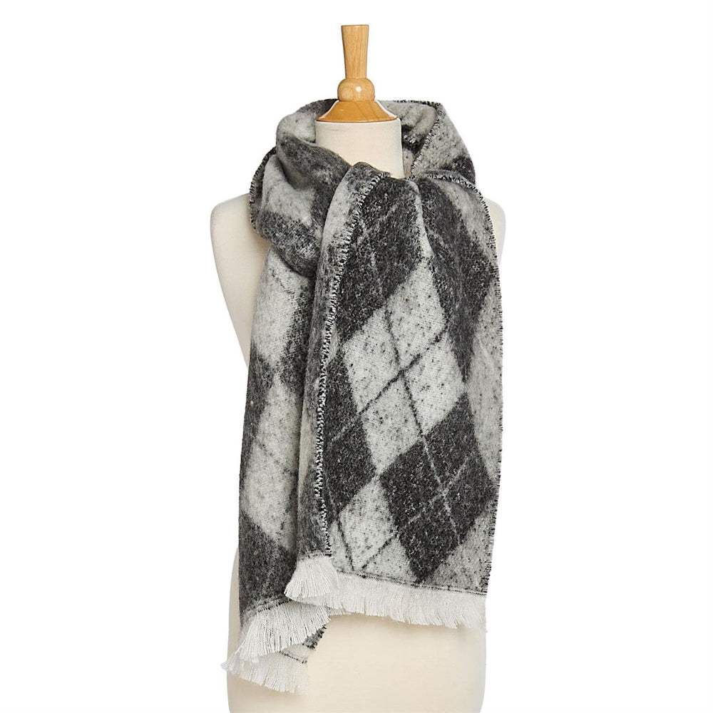 Black & white plaid scarf with white fringe edge on a mannequin against a white background