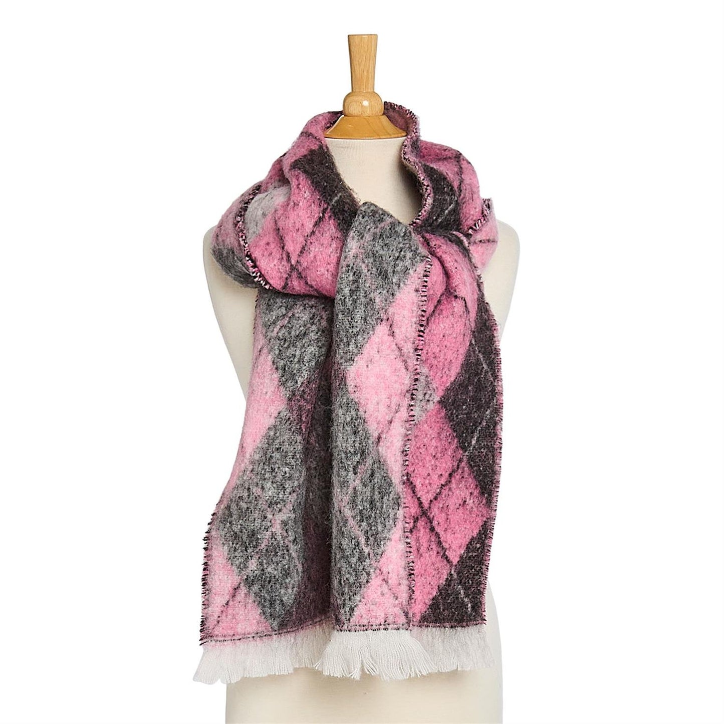 Pink and gray plaid scarf with white fring edge on a mannequin with a white background