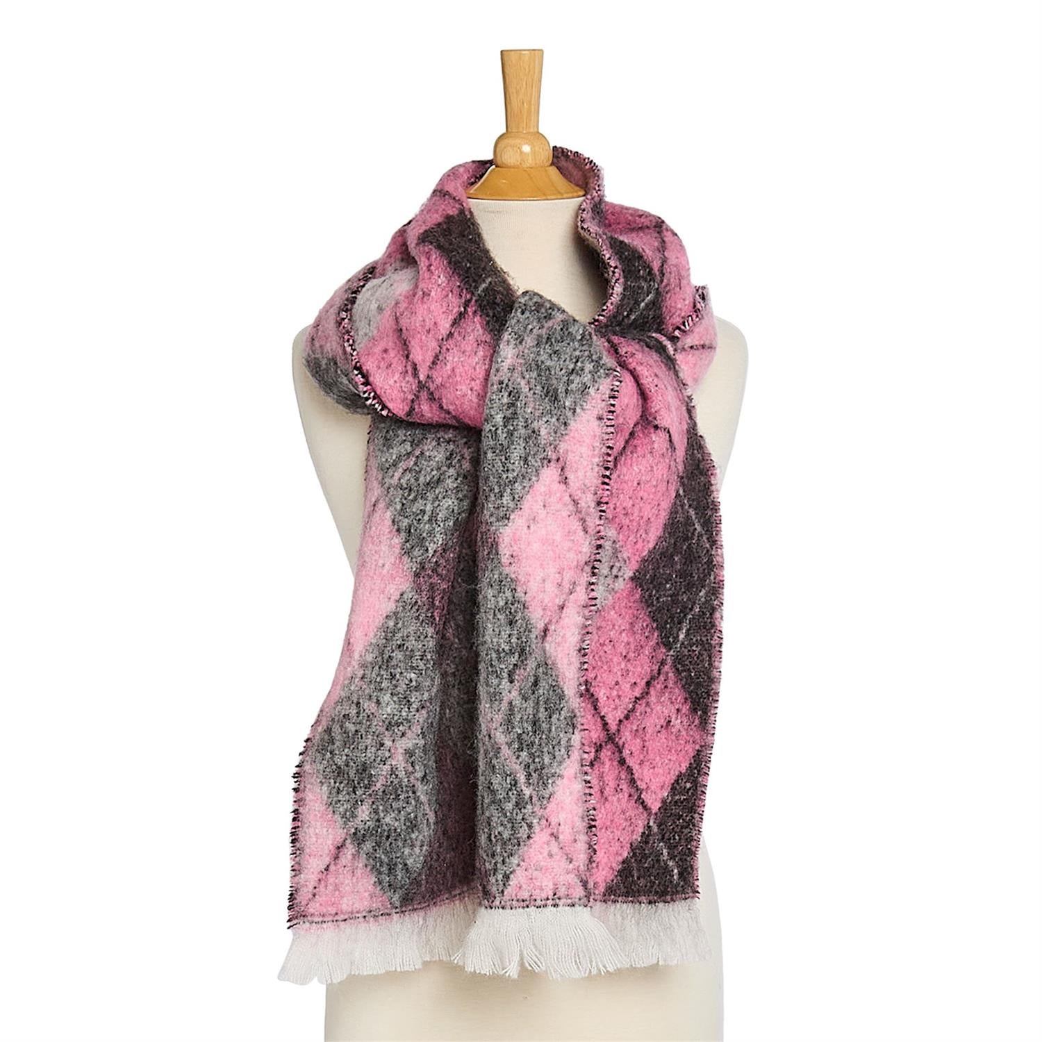 Pink and gray plaid scarf with white fring edge on a mannequin with a white background
