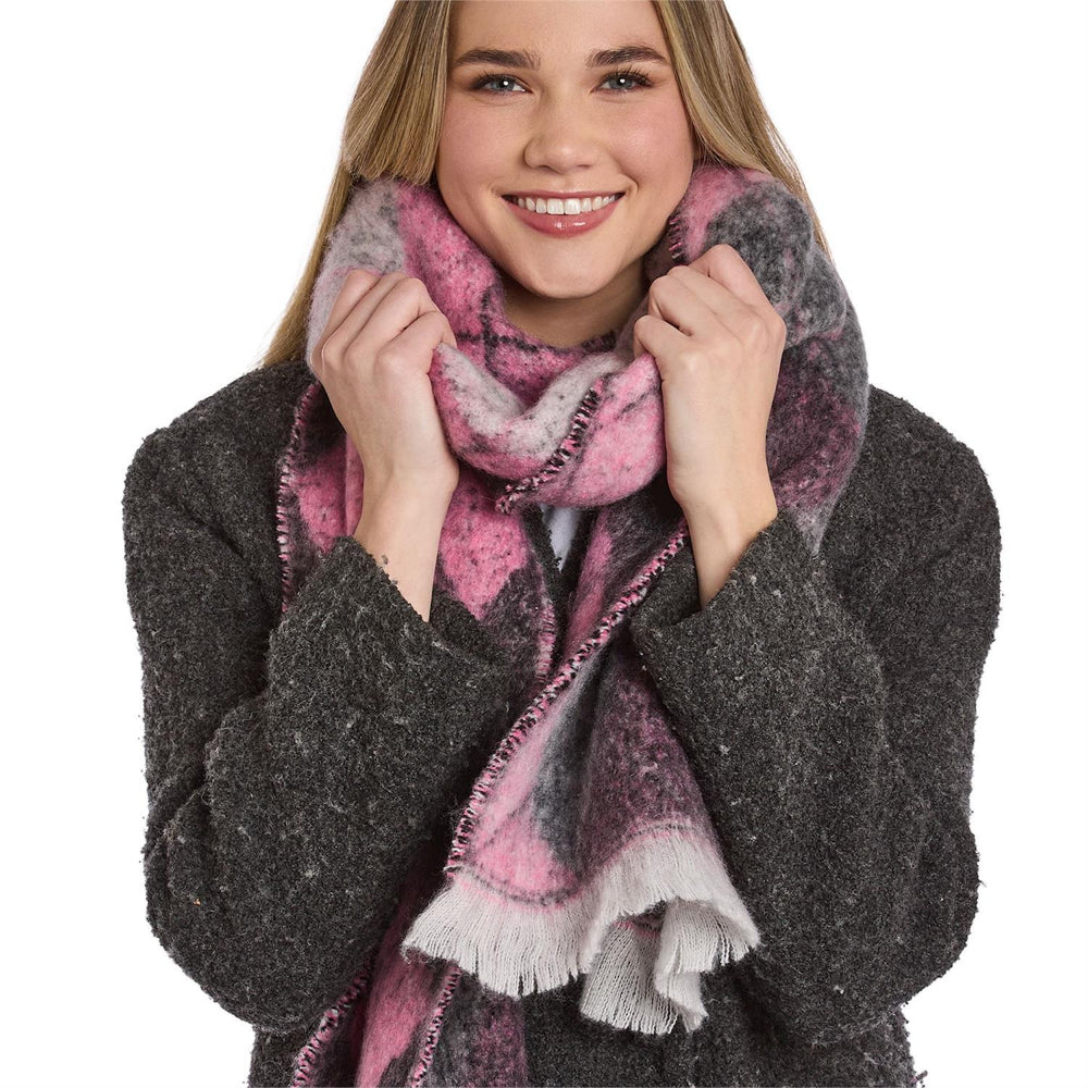 Woman wearing a pink and gray patterned scarf with white on a white background