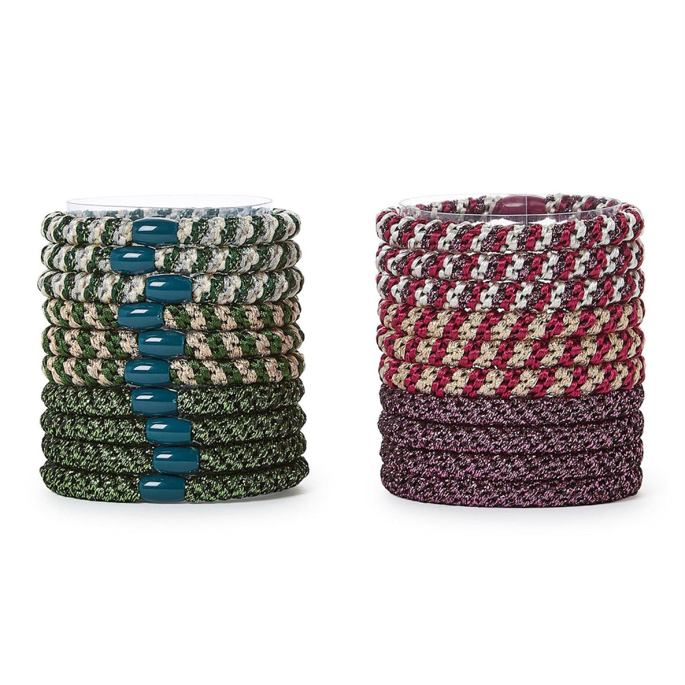 Set of red & green colorful hair ties in two stacks on a white background.