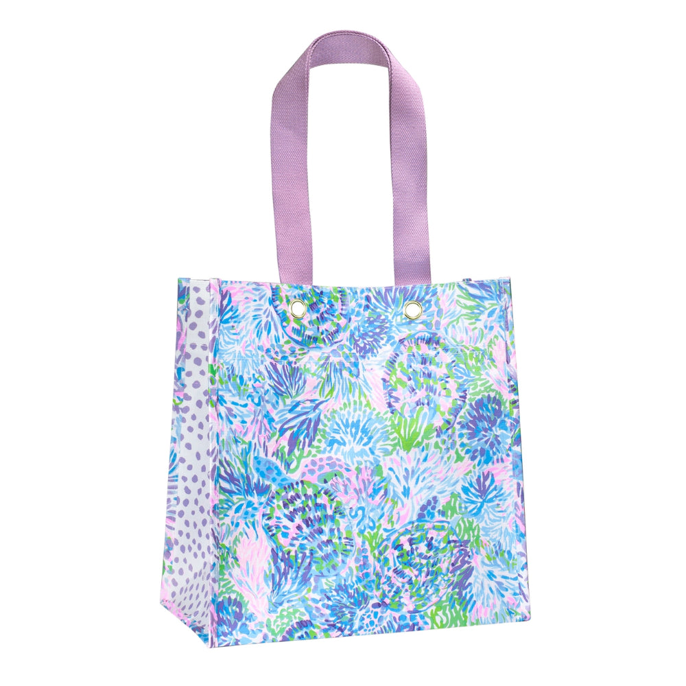 Colorful patterned tote bag with a purple handle on a white background.