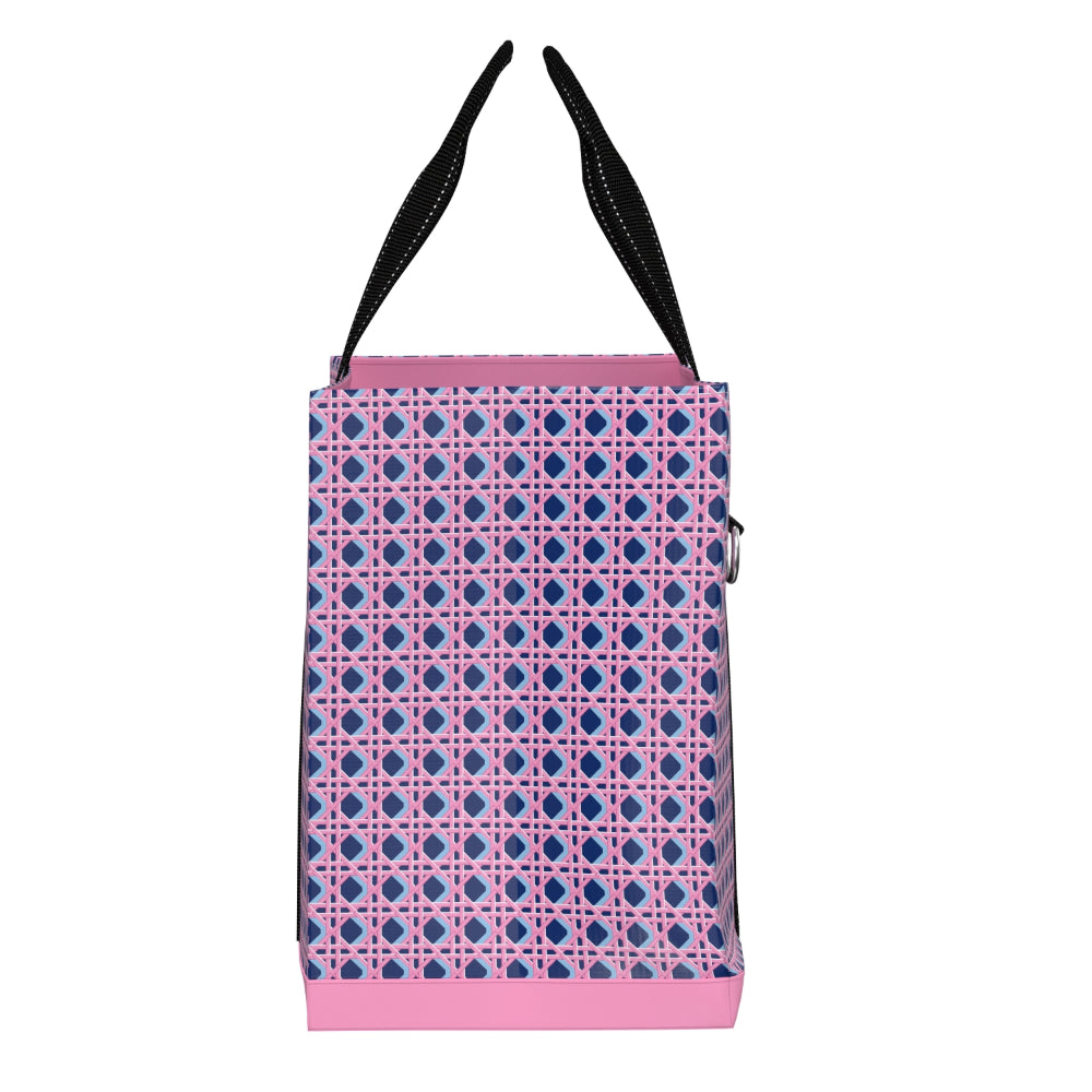 Pink and blue patterned bag with black straps on a white background