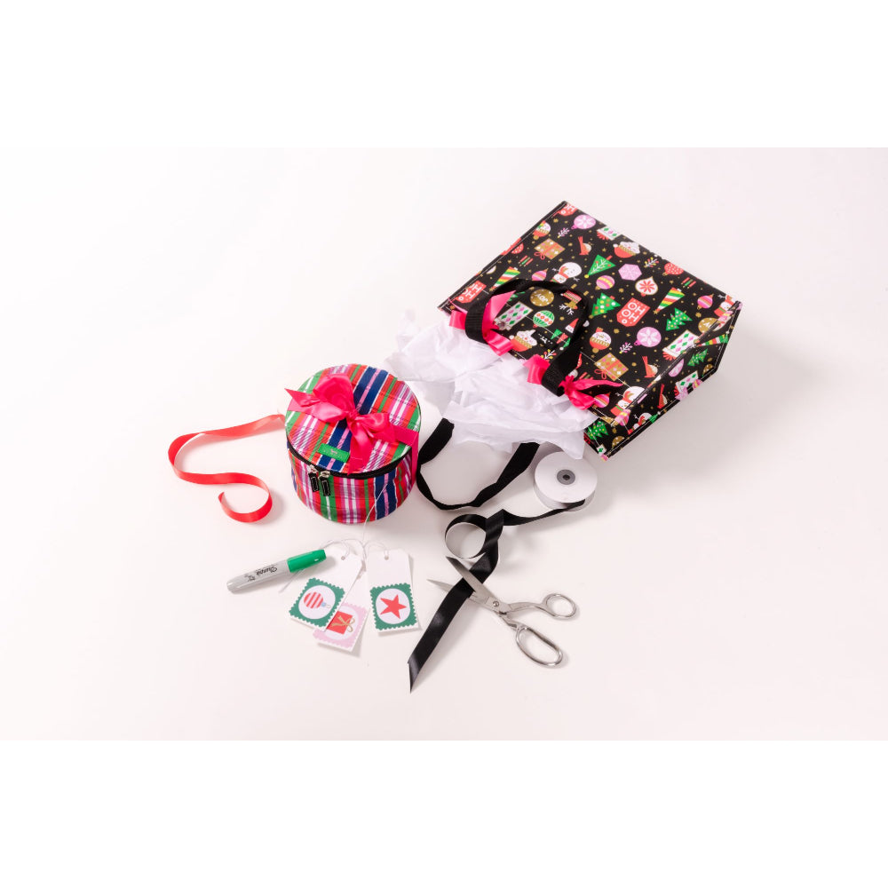 A gift wrap kit with various tools and supplies, including a patterned gift box, a striped gift hat, red ribbon, scissors, tape measure, markers, and tags, arranged on a white background.