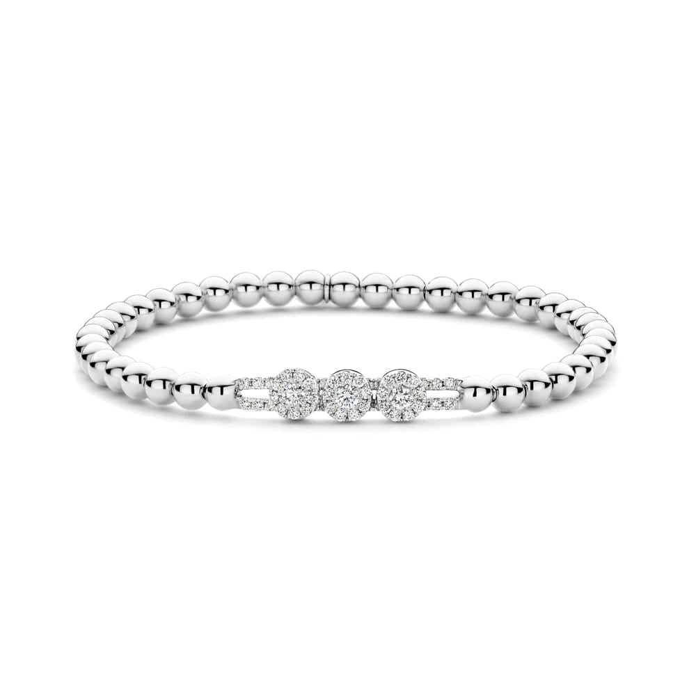 Silver bracelet with diamond accents on a white background