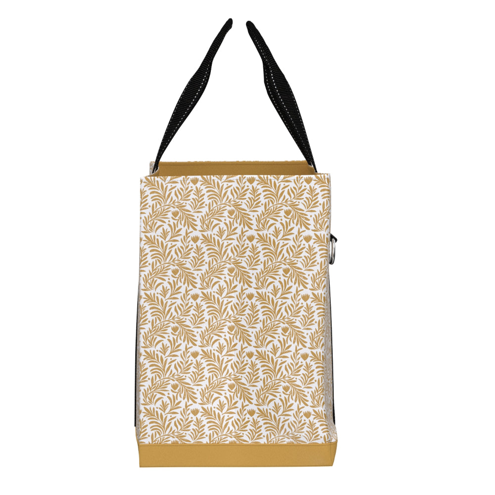 A tote bag featuring a white body with a repeating tan leaf pattern, black shoulder straps, and a solid tan base, shown against a plain white background.