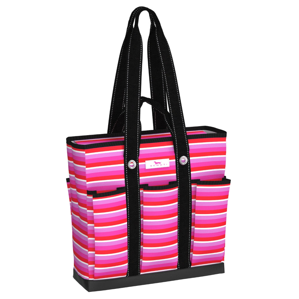 A striped tote bag with horizontal pink, magenta, and white stripes, featuring black shoulder straps with white stitching, a black base, and silver snap buttons on the front pockets.