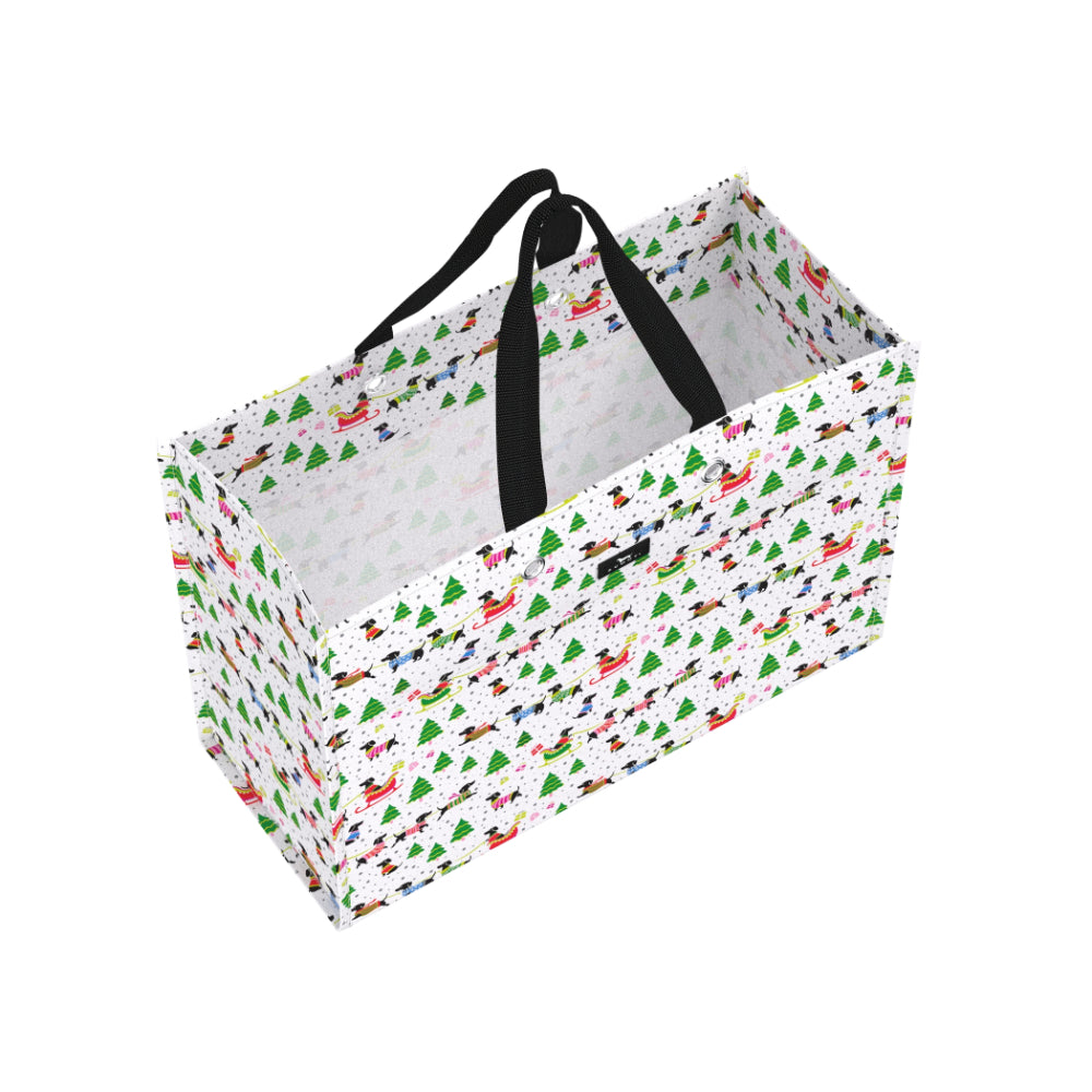 A rectangular gift bag with a white background and a colorful pattern of small red, green, blue, and black illustrations. It has two black fabric handles.