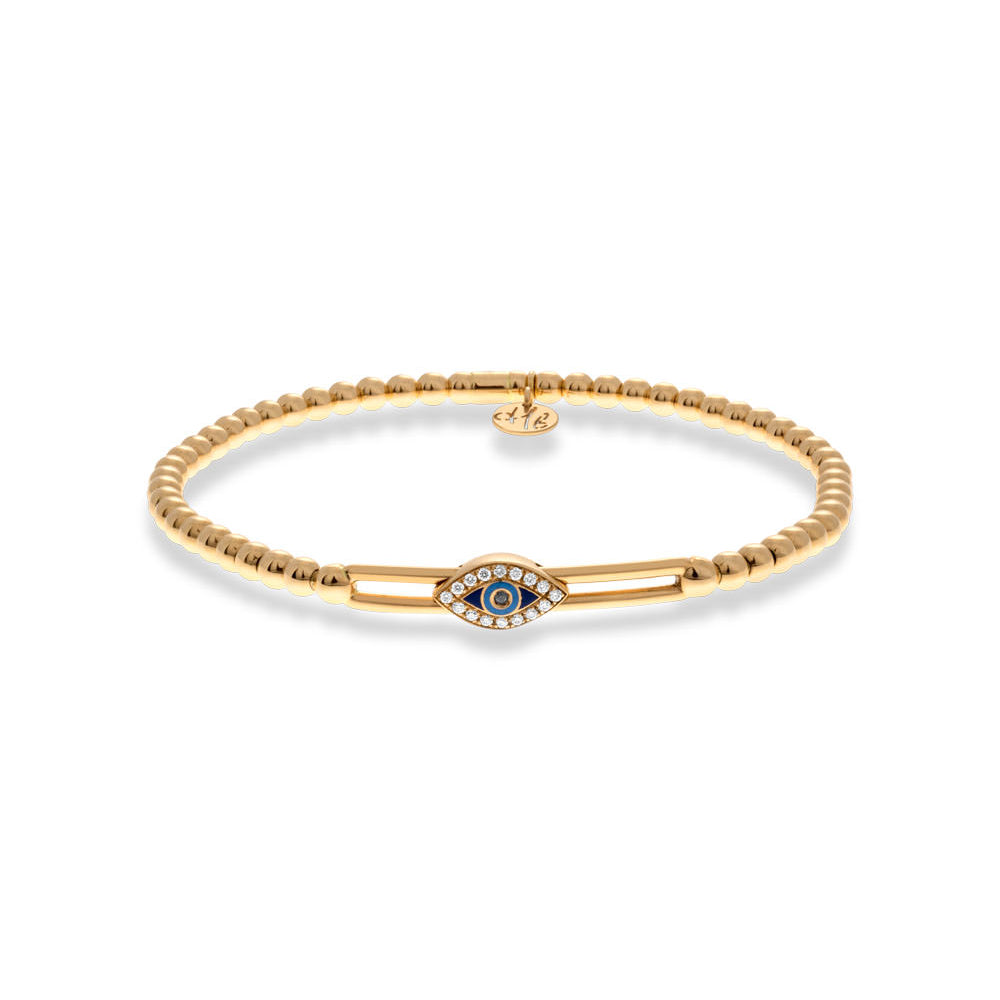 Gold bracelet with a blue gemstone on a white background