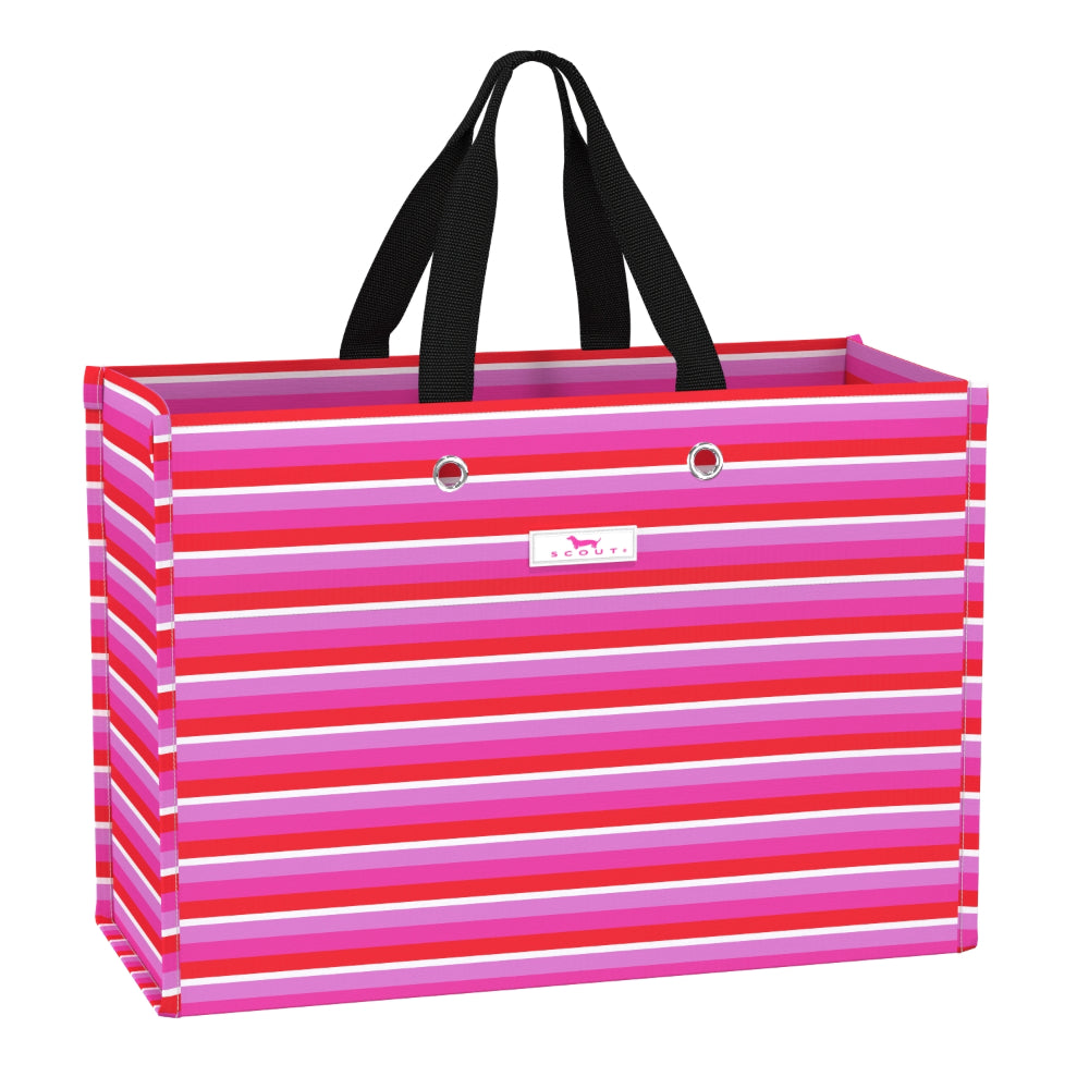 A rectangular gift bag with horizontal pink, red, and white stripes, featuring black shoulder straps and a small white brand plaque on the front.