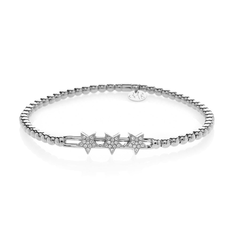 Gold bracelet with star-shaped charms on a white background