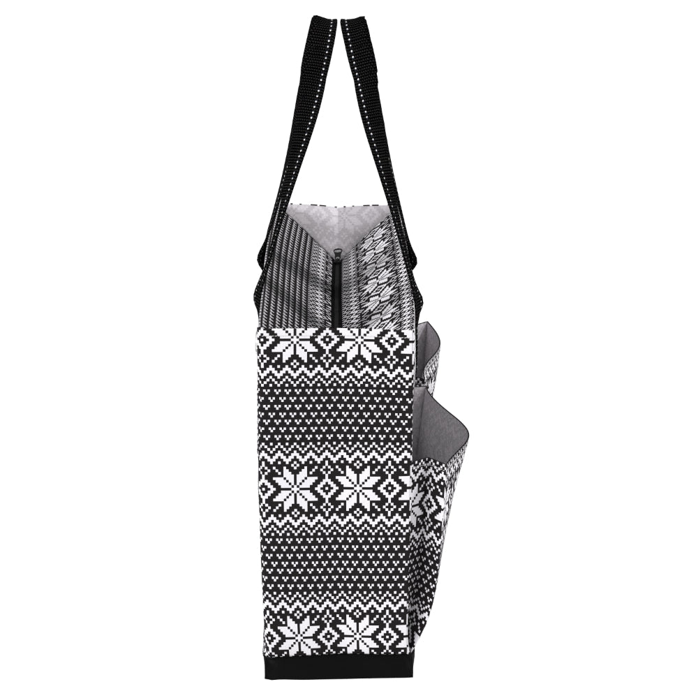 A black and white patterned tote bag with a Fair Isle snowflake design, featuring dual shoulder straps and a zippered main compartment.