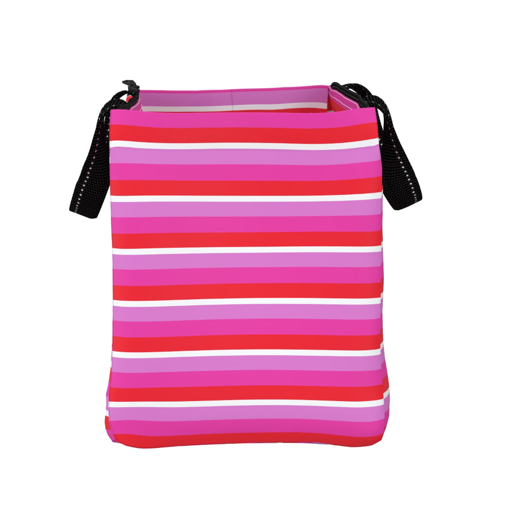 A rectangular shoulder bag with horizontal pink, red, and white stripes, featuring black shoulder straps on the sides, shown against a plain white background.