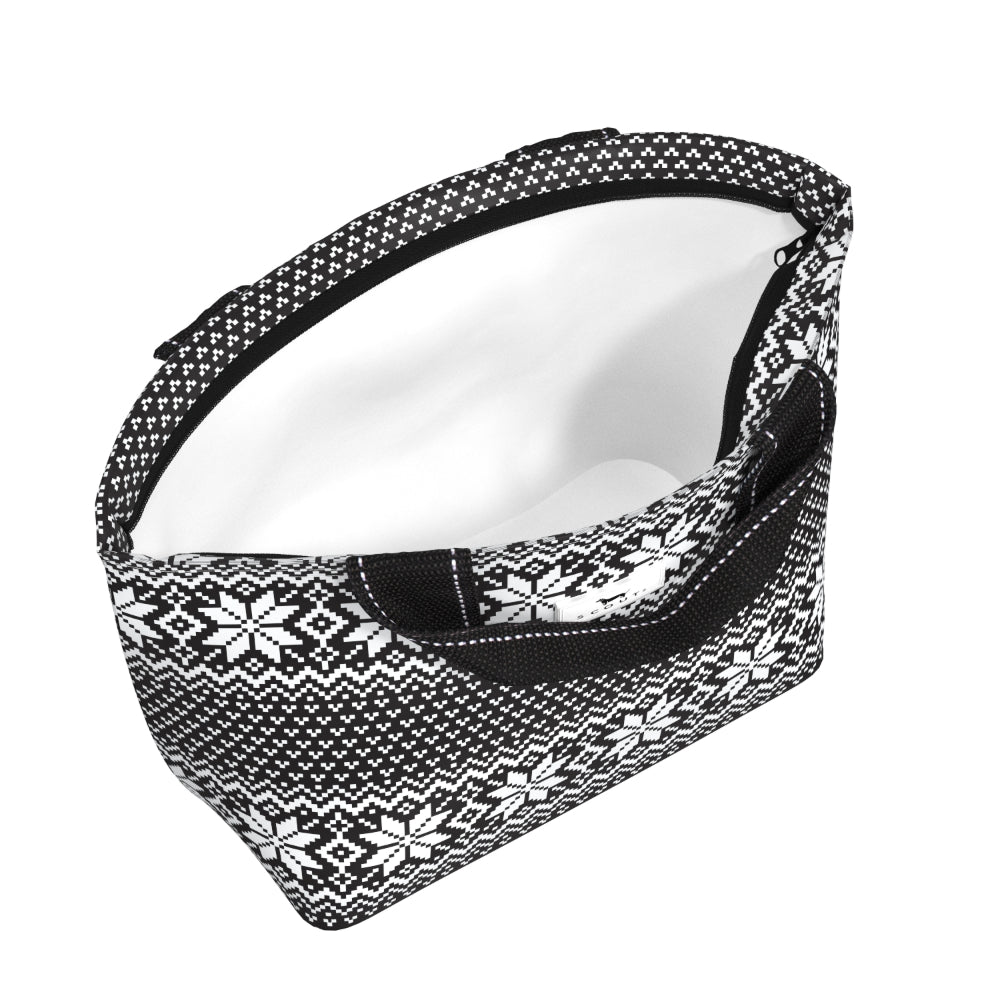 A zippered lunch bag with a black and white Nordic snowflake pattern exterior and a white interior lining, shown on a plain white background.