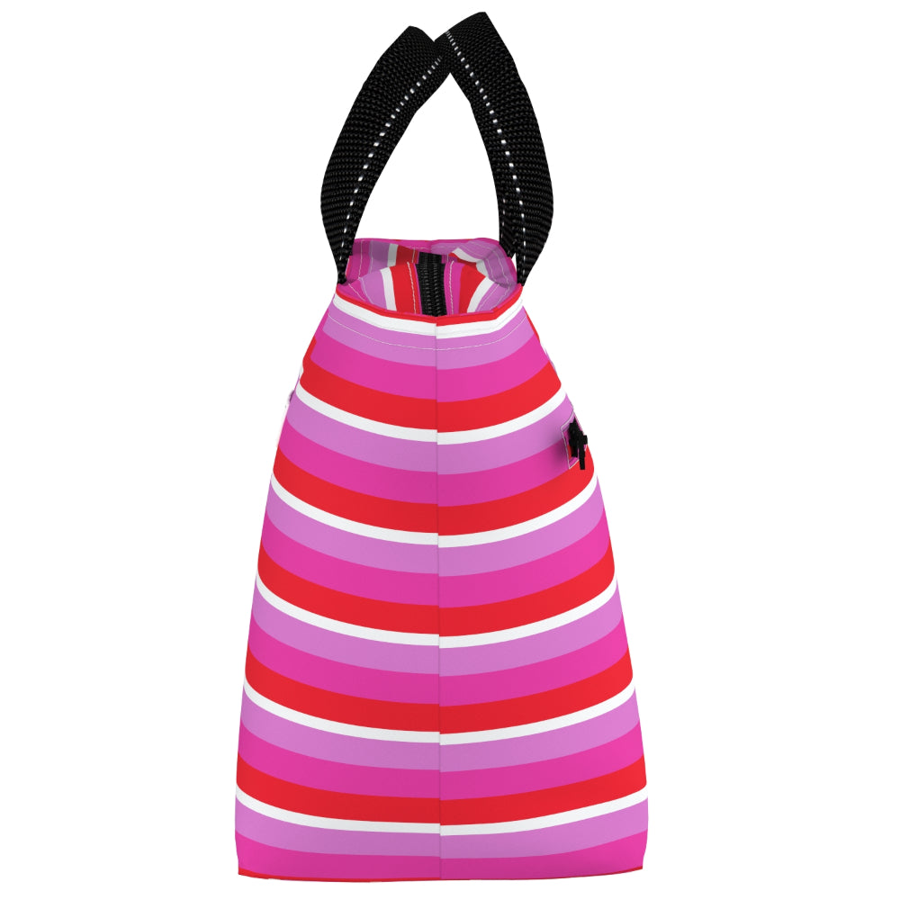 A striped reusable bag with black shoulder straps, featuring horizontal stripes in shades of pink, red, and white, with a small black embroidered polo player logo on the side.