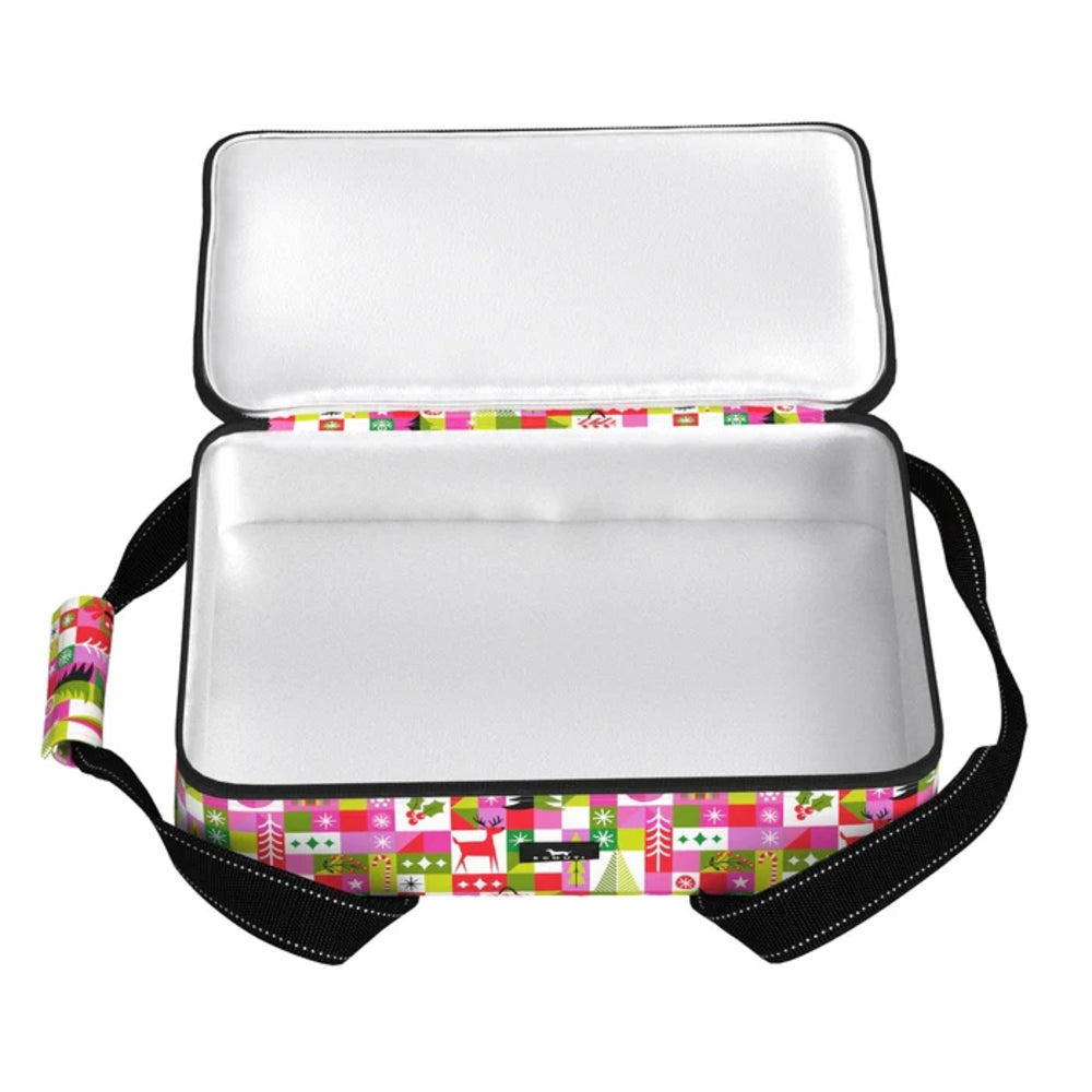 An open rectangular insulated box with a white interior and a colorful patchwork-patterned exterior featuring pink, green, and white blocks with small holiday motifs. Black handles are attached on both sides against a plain white background.