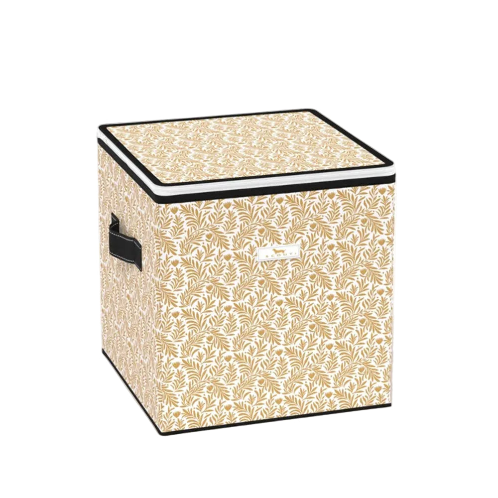 A square fabric storage bin with a beige and white leaf pattern, black trim, and a black handle on the side, shown on a white background.