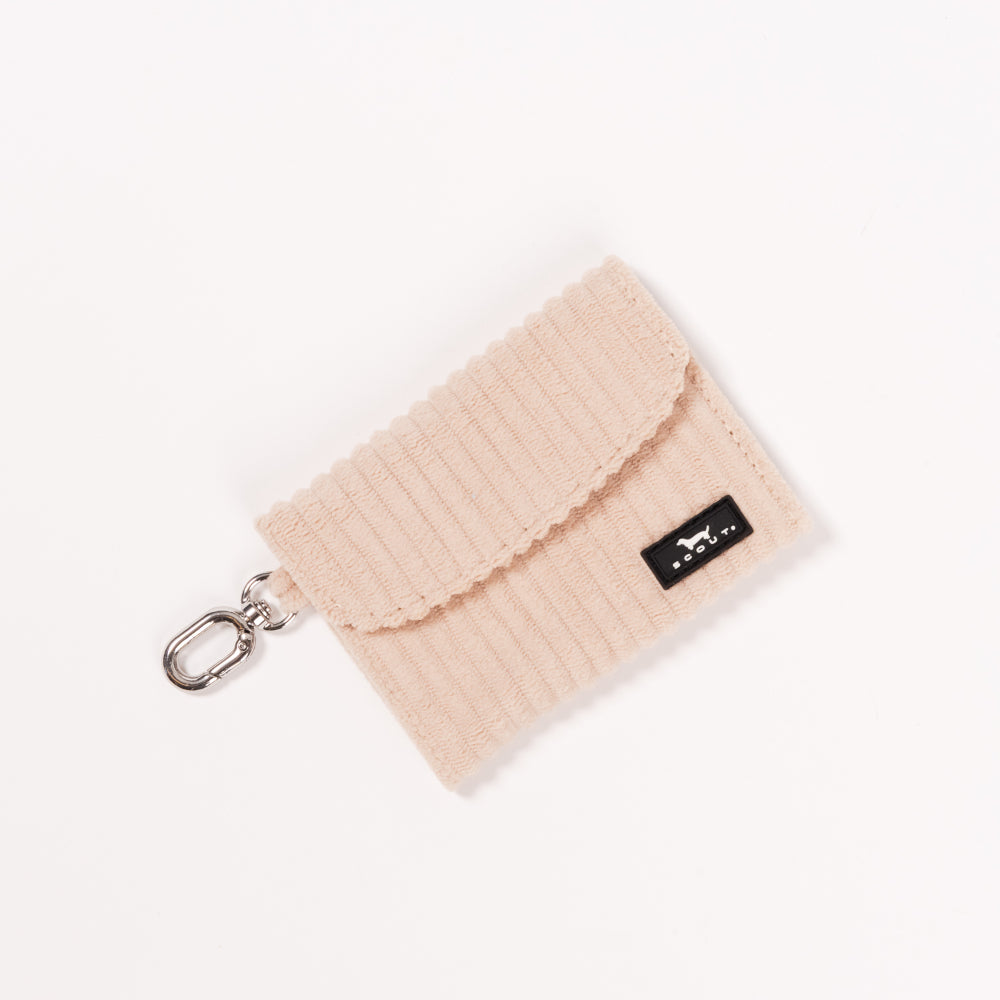 Tan card holder with a keychain on a white background