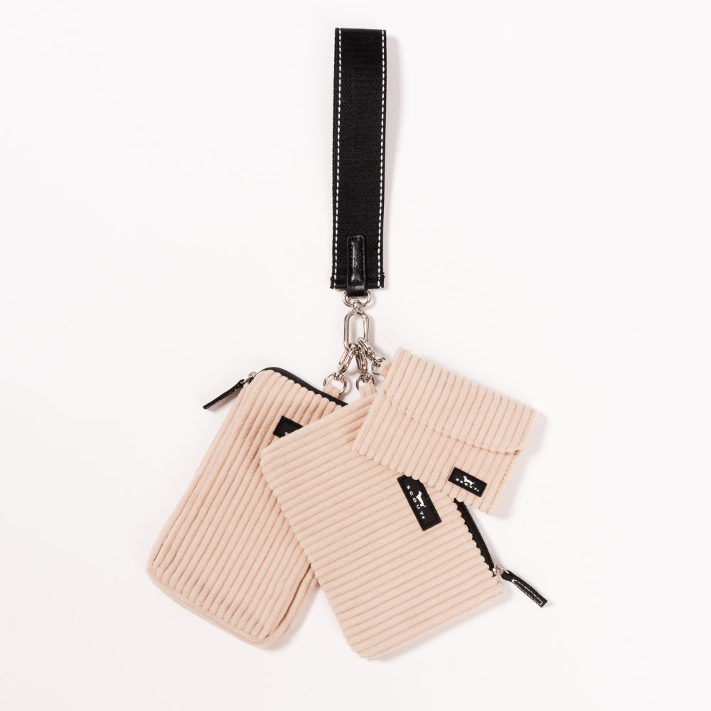 Beige ribbed pouches with black zippers and a black strap on a white background