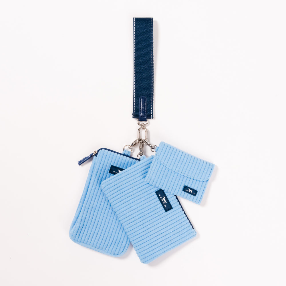 Set of blue textured pouches with a keychain on a white background