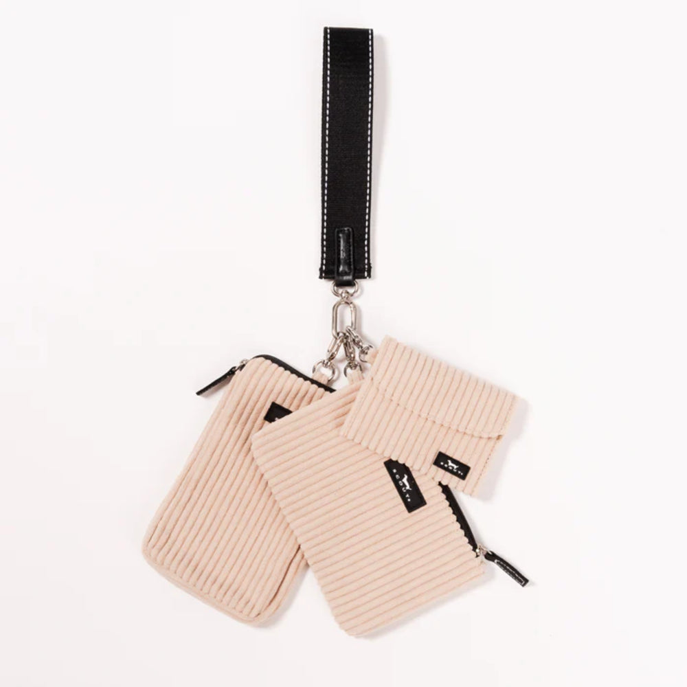 A set of three small beige corduroy zippered pouches with a black wrist strap and silver metal hardware, displayed on a clean white background.