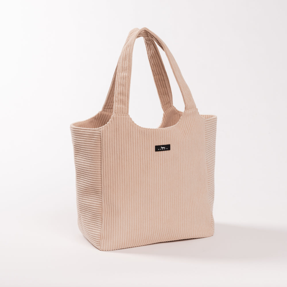 Beige tote bag with a small logo on a light gray background