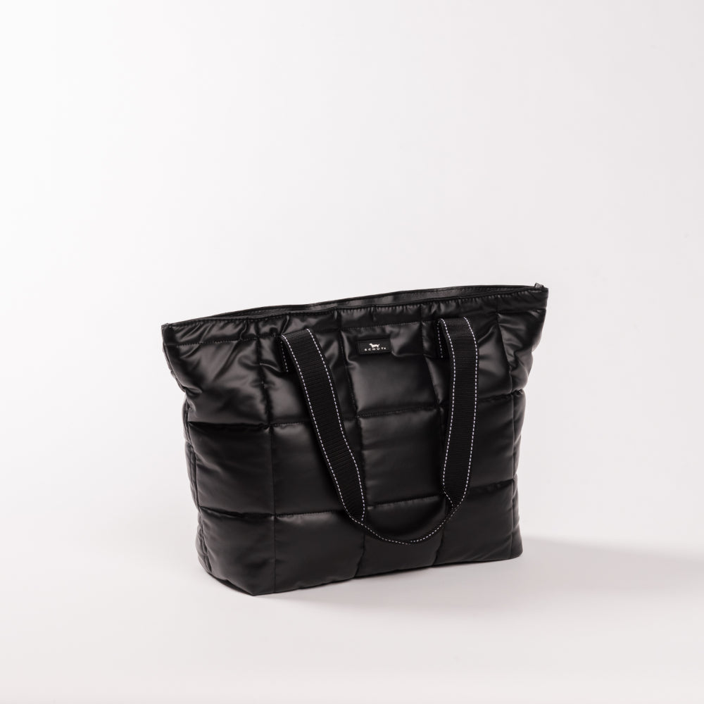 Black quilted tote bag on a white background