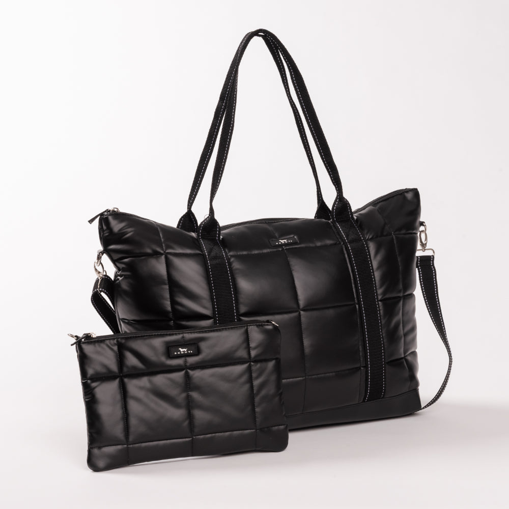 Black quilted handbag with a smaller matching pouch on a white background