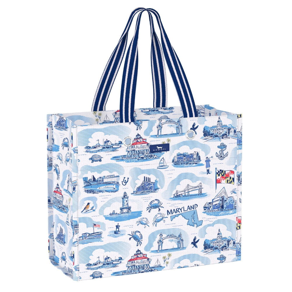 A reusable tote bag with a blue and white Maryland-themed toile pattern, featuring navy blue and white striped handles, shown on a plain white background.