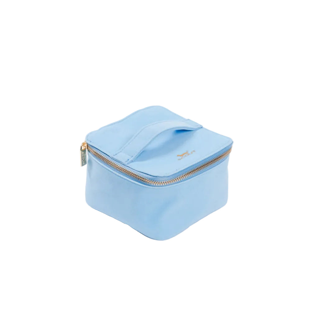 A light blue zippered pouch with a top handle, featuring a small gold logo on the front and a gold zipper pull, photographed on a clean white background.