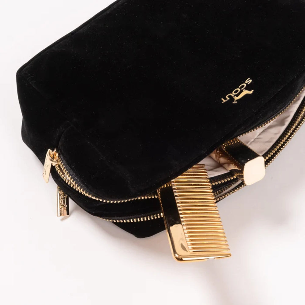 Black velvet pouch with gold zipper and accents on a white background