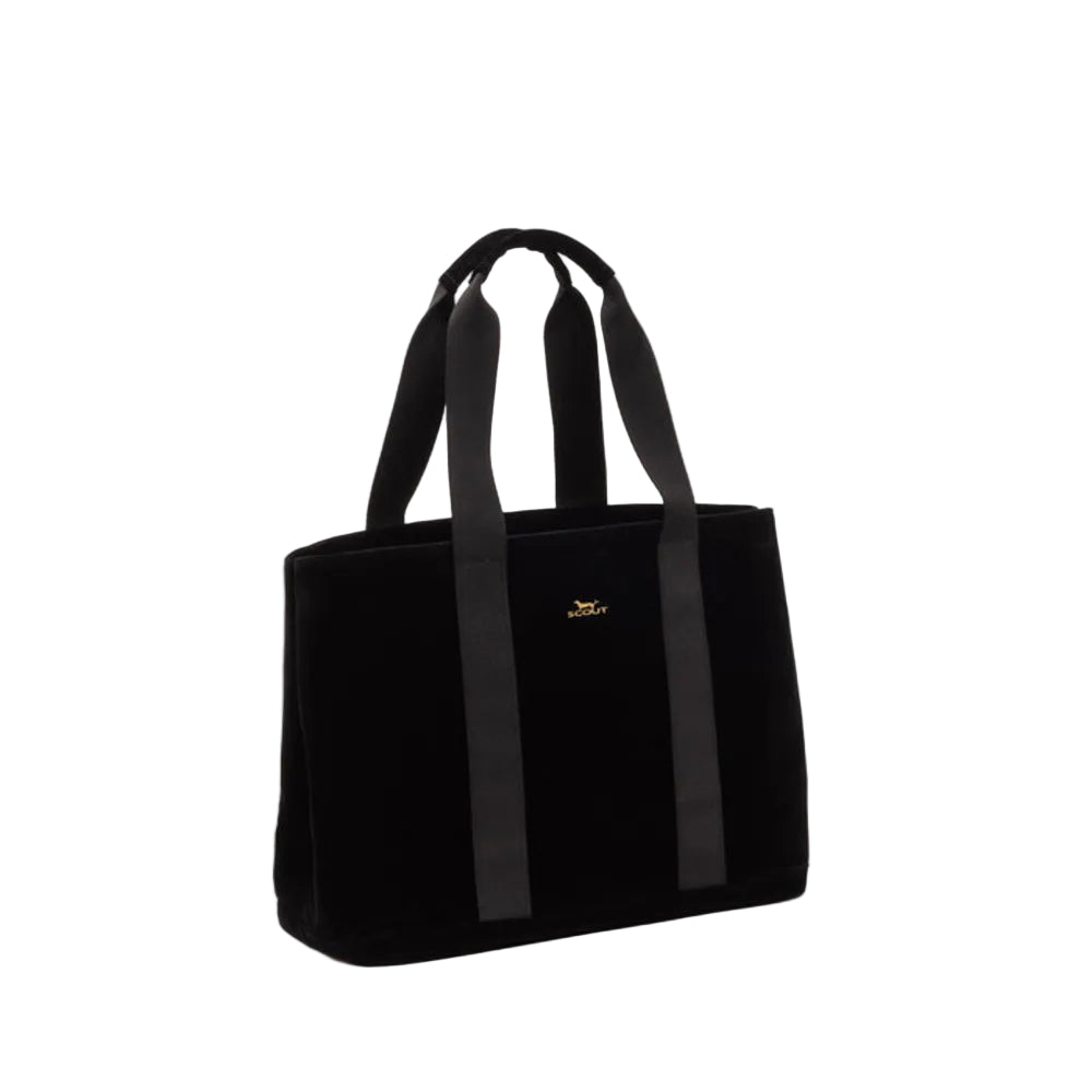 A black velvet tote bag with black webbing handles and a small gold logo on the front, photographed on a clean white studio background.