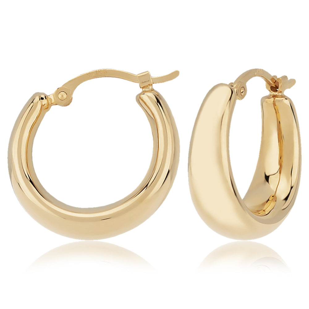 Gold hoop earrings on a white background