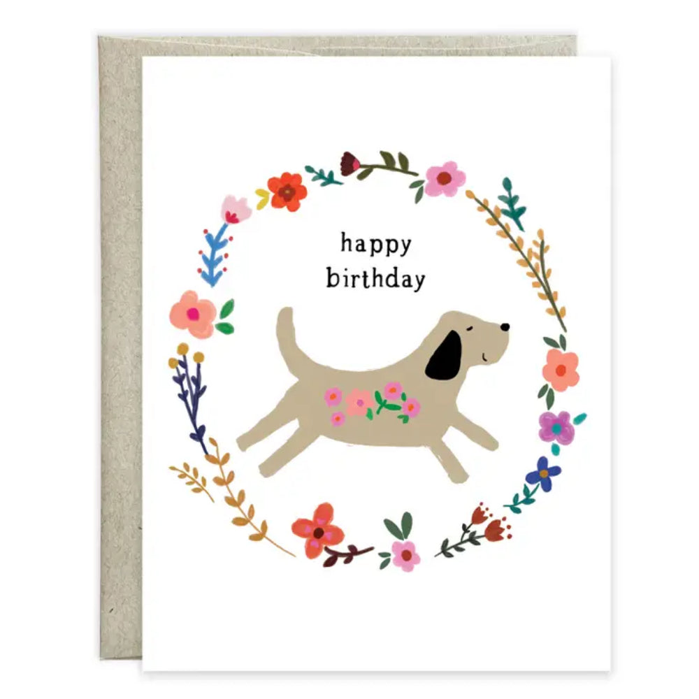 Birthday card with a dog illustration and floral wreath on a white background