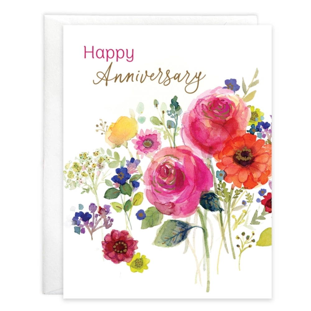 A white greeting card with the words 'Happy Anniversary' in pink and gold script above a colorful watercolor floral bouquet, shown with a white envelope behind it on a white background.