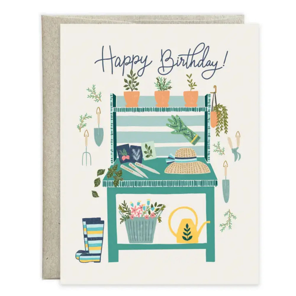 Birthday card with a garden-themed illustration of a bench, plants, and gardening tools.