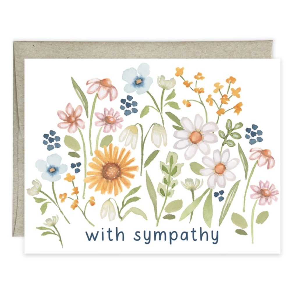 A sympathy greeting card with a watercolor floral design in pastel colors and the printed words 'with sympathy' at the bottom, shown with a kraft envelope behind it on a white background.