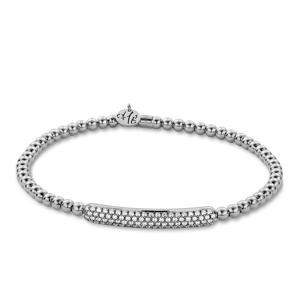 Gold bracelet with a pave diamond center bar on a white background