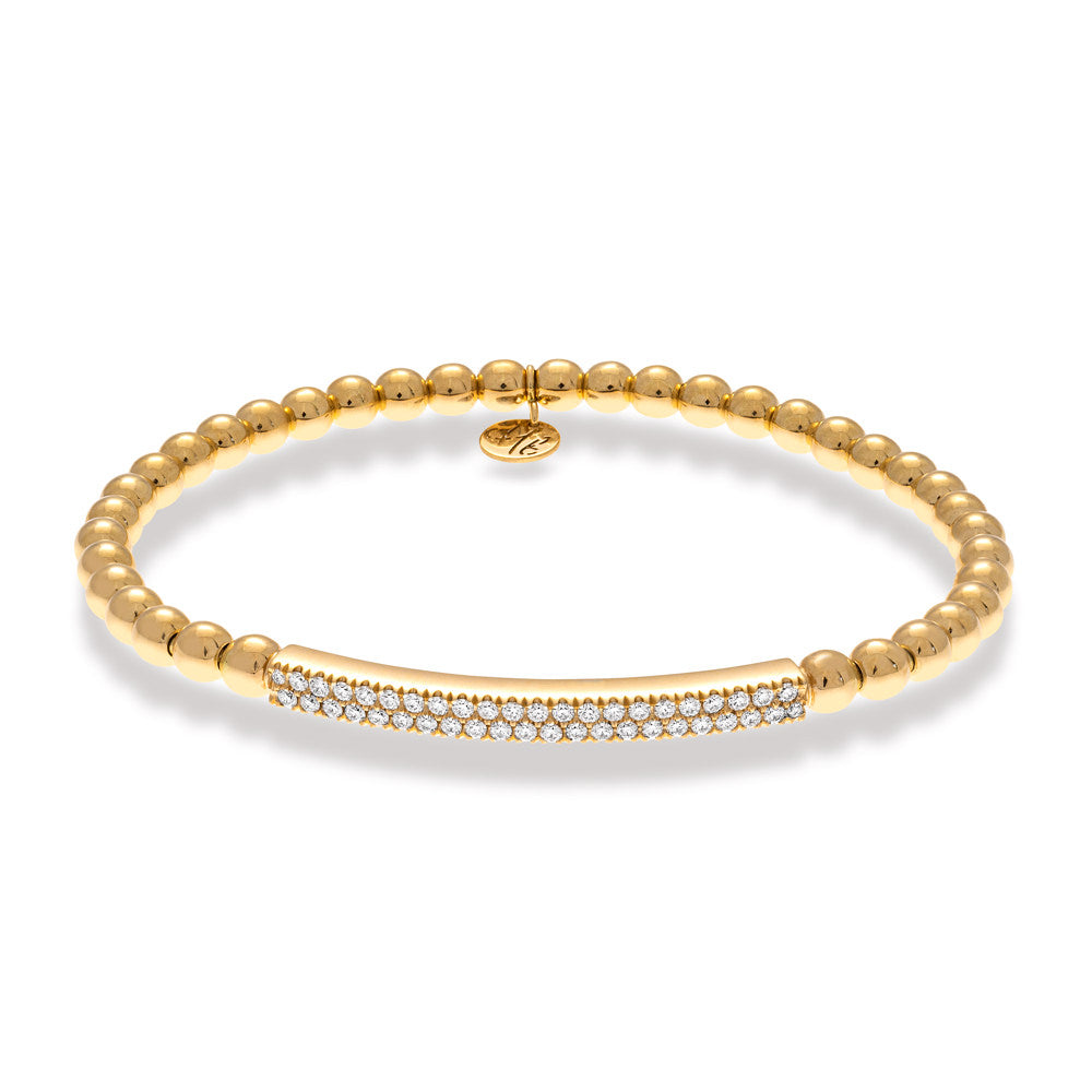 Gold bracelet with embedded diamonds on a white background