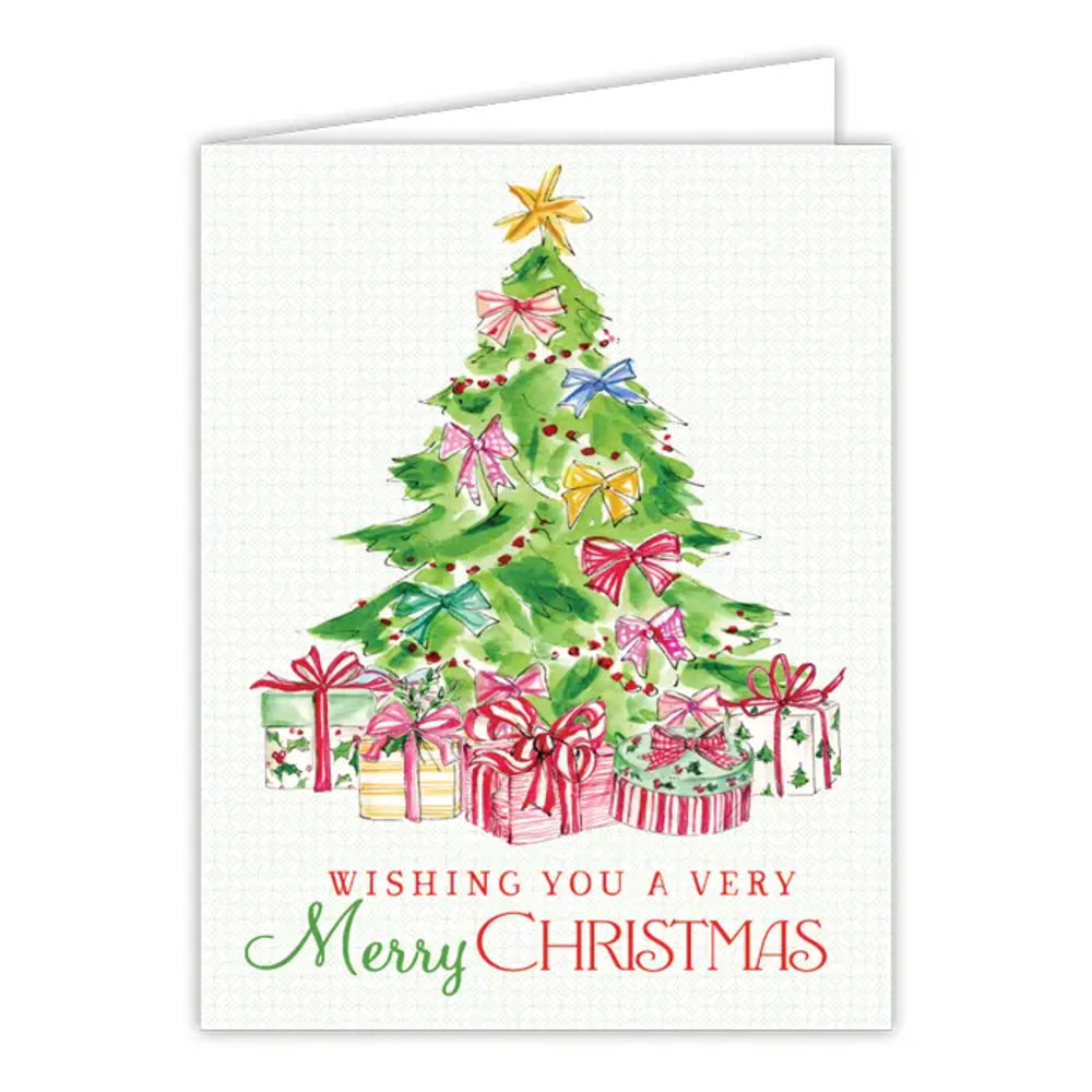 A Christmas greeting card featuring a watercolor-style green Christmas tree with colorful bows, a gold star topper, wrapped presents, and the text 'Wishing you a very Merry Christmas' on a white card.